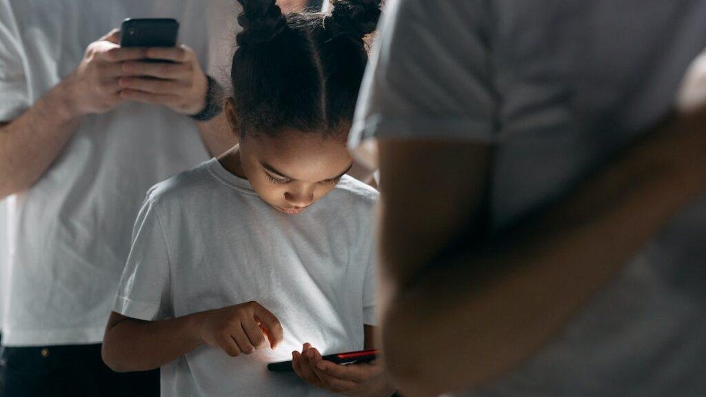 Photo of Girl Using Smartphones